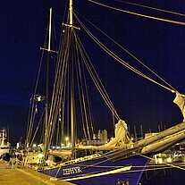 The Zephyr at night on the quay