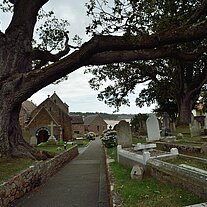 Church with tree and cemetery St. Brelade